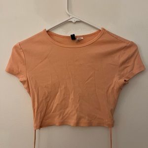 Dynamite pink crop top with wrap around stomach.